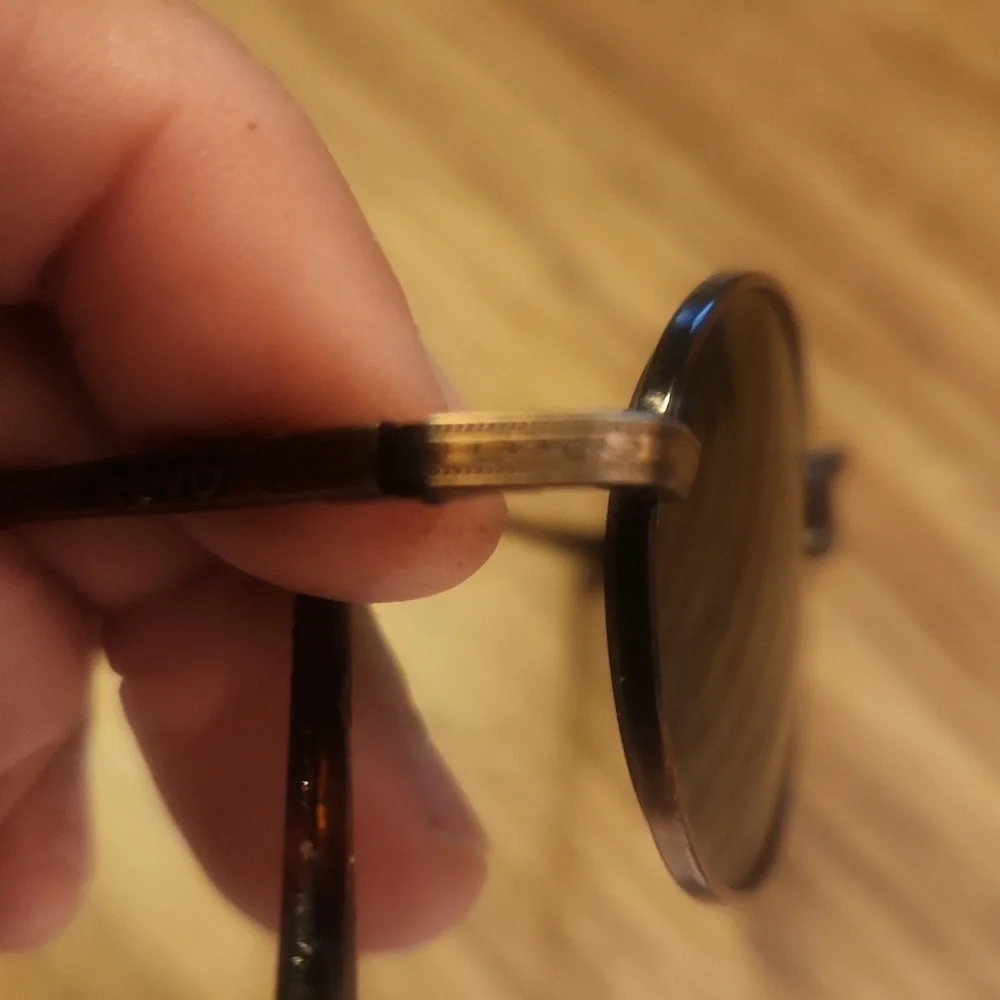 Revo Oval Copper Frame Sunglasses with Dark Gray Lenses